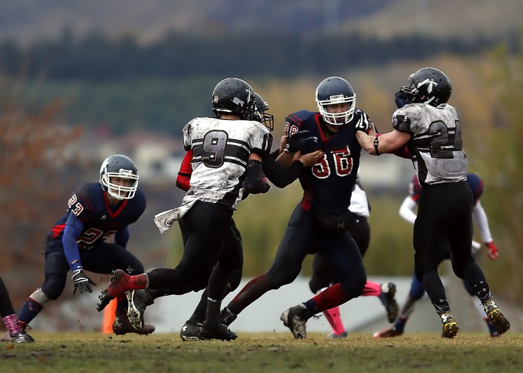 young football players Photo by Keith JJ via Pixabay