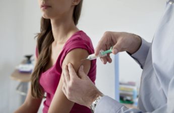 you woman getting HPV vaccine