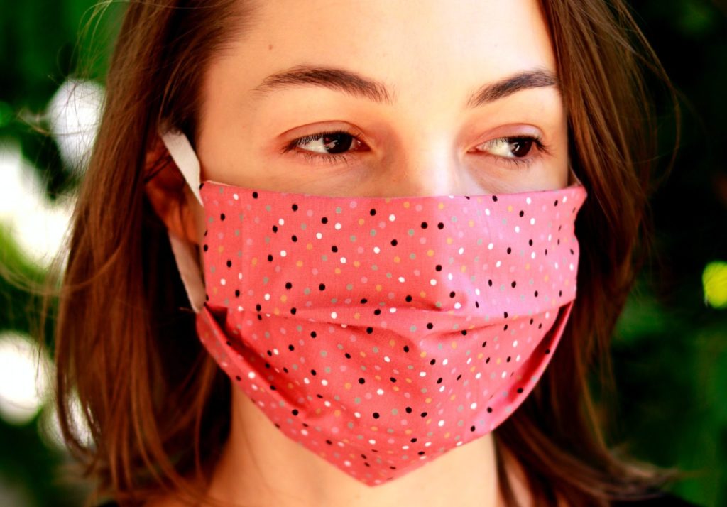 Young woman wearing a cloth face mask.