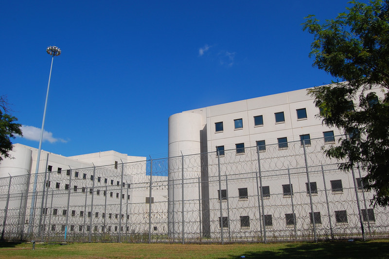 Picture of Cook Couty Jail surrounded by high cyclone fencing and razor wire.