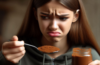 AI-generated image of a teenage girl holding a spoonful of cinnamon in front of her face with a look of disgusts.