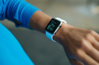 Picture of a fitness tracker on a woman's arm.